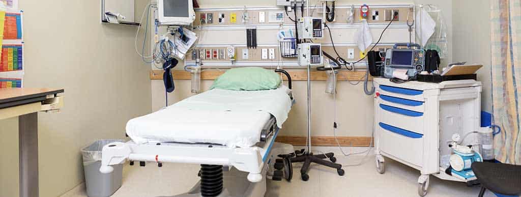 Professional medical facility cleaning team performing hospital-grade disinfection